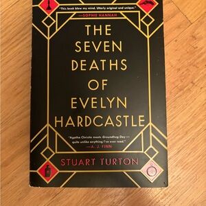 The Seven Deaths of Evelyn Hardcastle by - Black and Gold Cover